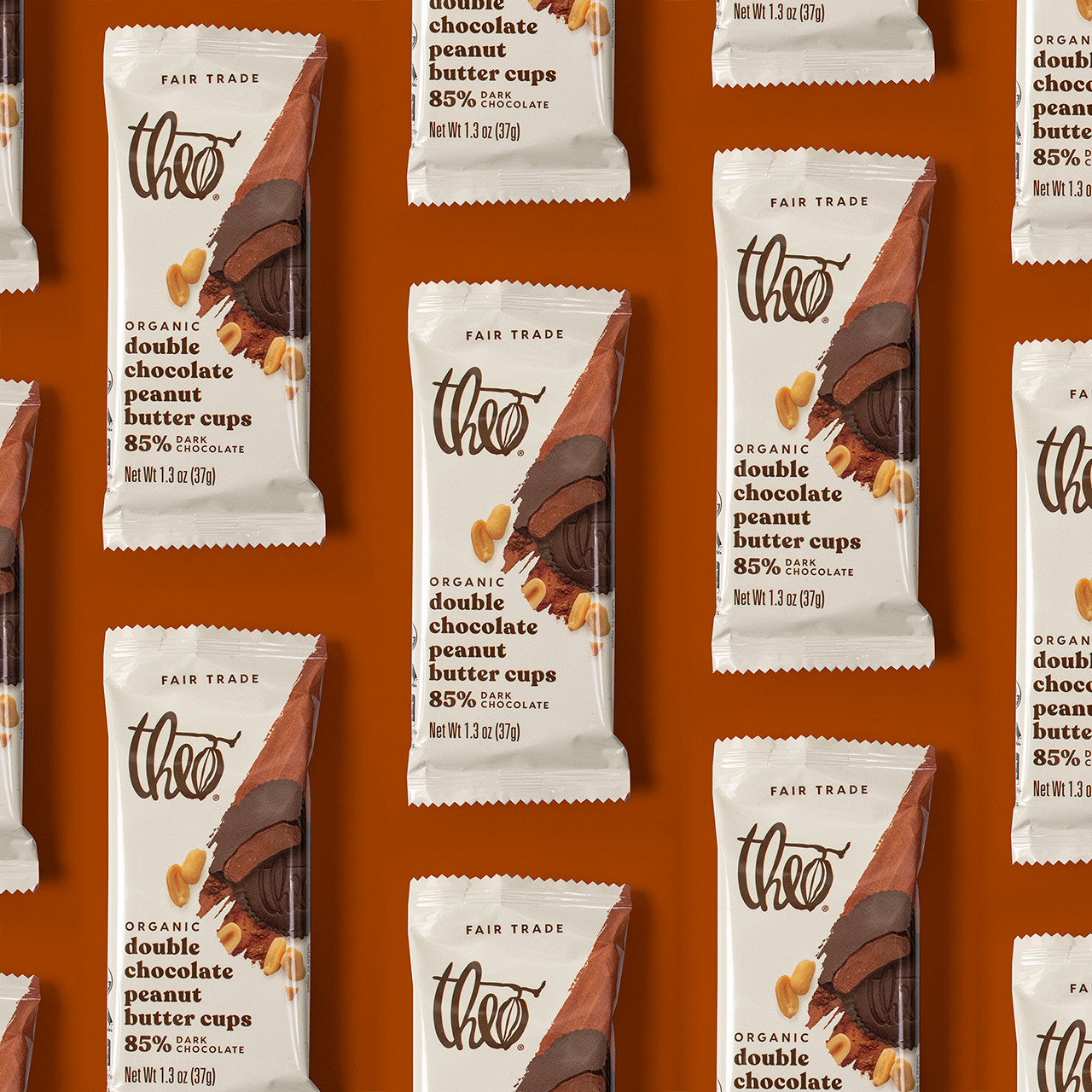 Pattern of Theo Organic double chocolate peanut butter cups packaging on a brown background