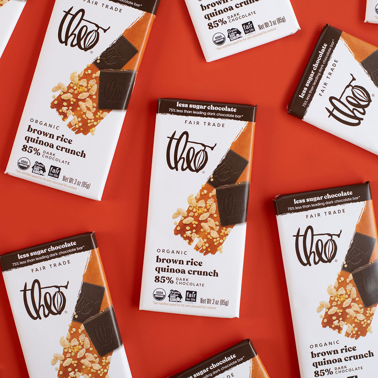 Theo dark chocolate bars with brown rice quinoa crunch on a red background