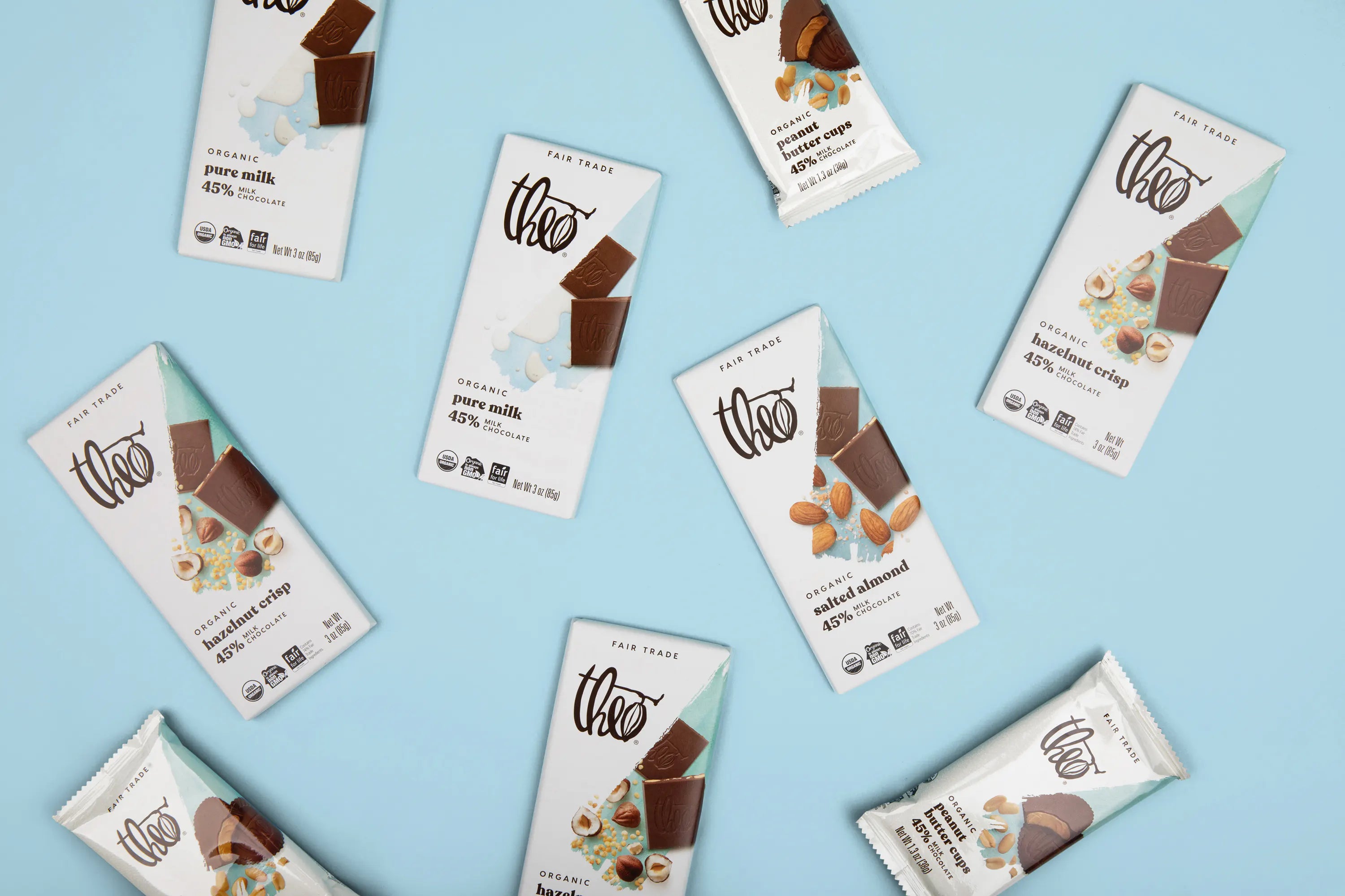 Various Theo chocolate bars on a light blue background