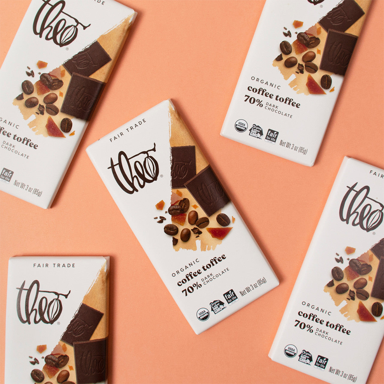 Theo Organic Coffee Toffee chocolate bars on a peach background