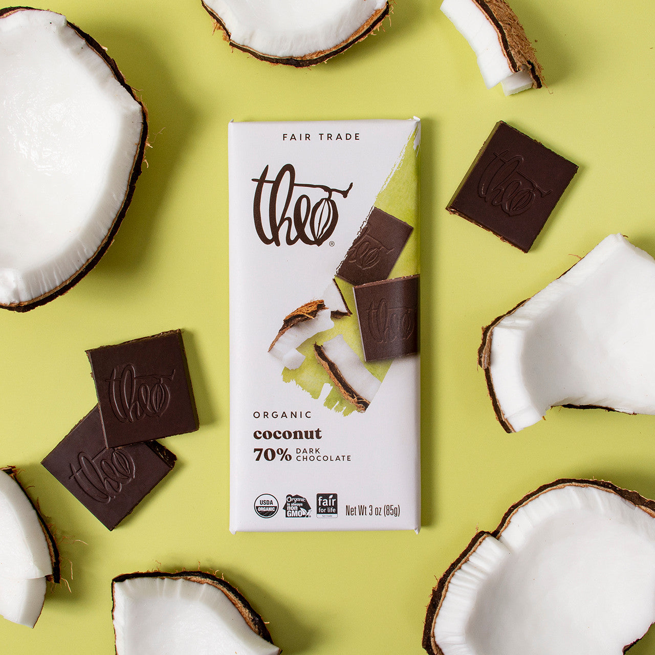 Theo Organic Coconut 70% Dark Chocolate bar with coconut pieces on a green background