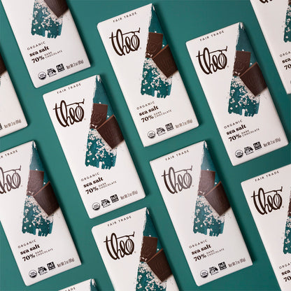 Multiple Theo Organic Sea Salt 70% chocolate bars on a teal background