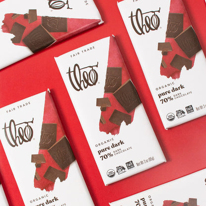 Theo Organic pure dark chocolate bars on a red background