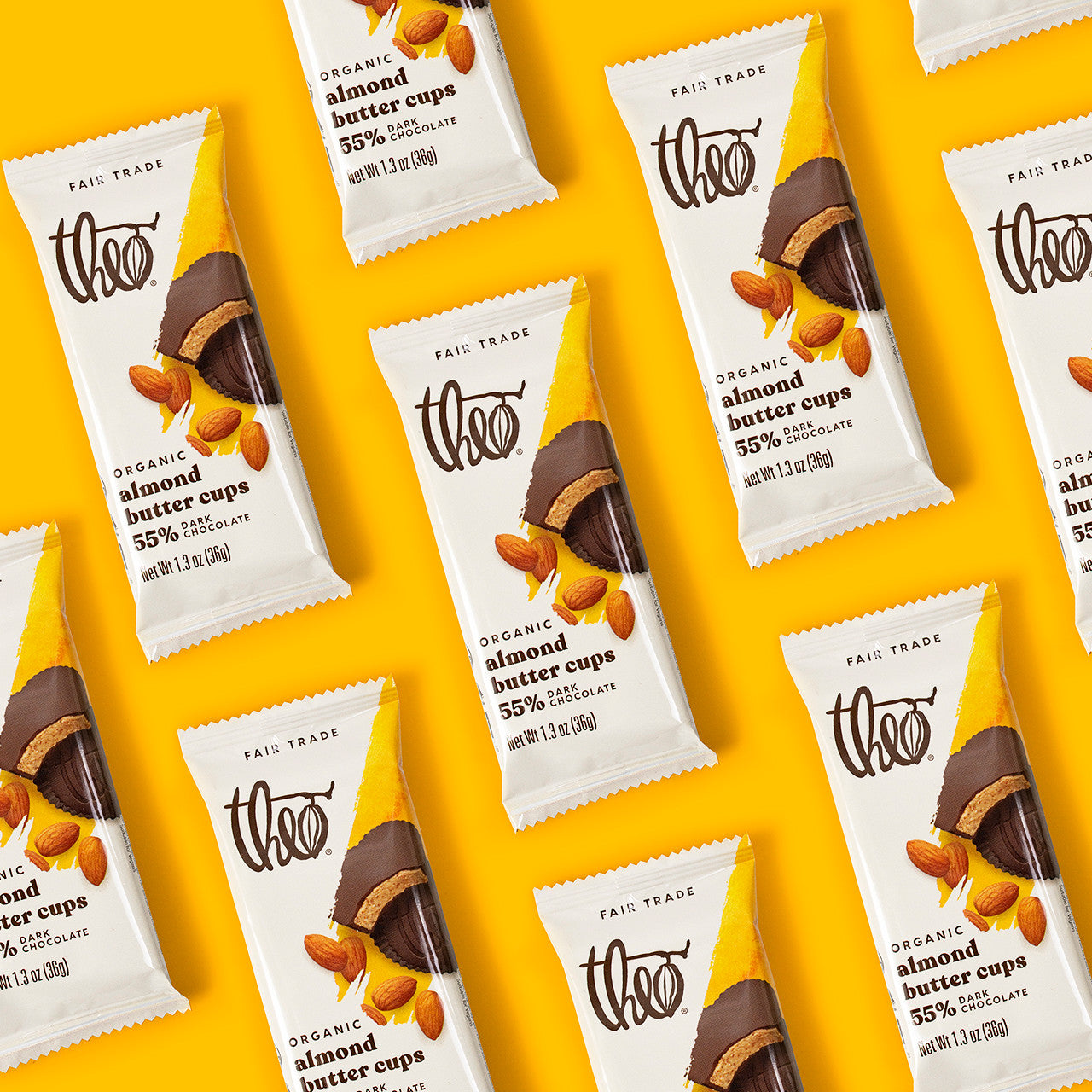 Pattern of Theo Organic Almond Butter Cups packaging on a yellow background