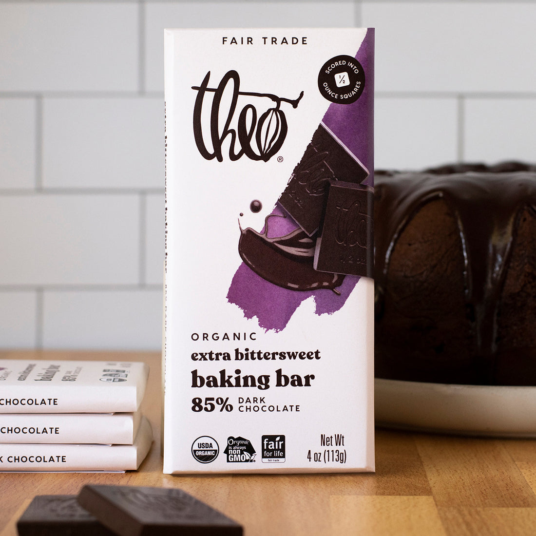 Theo organic extra bittersweet baking bar packaging on a wooden surface with a blurred background