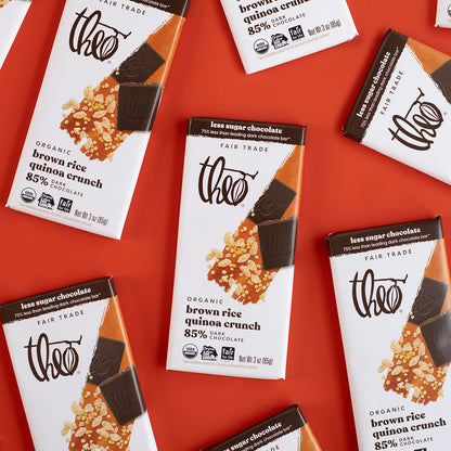 Theo dark chocolate bars with brown rice quinoa crunch on a red background