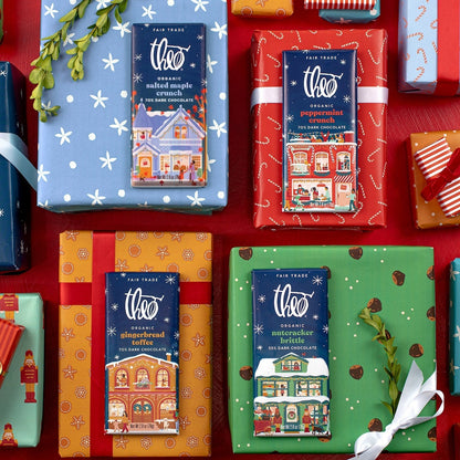 Theo holiday bars on wrapped gifts in festive paper