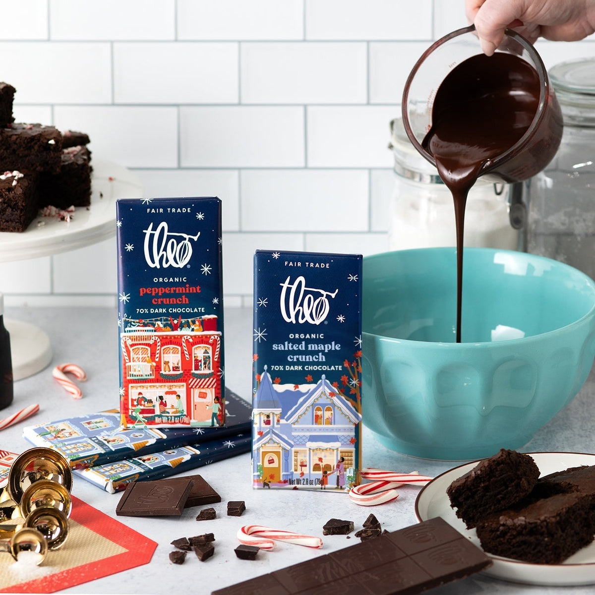 Holiday baking scene with melted chocolate, brownies and Theo Salted Maple Crunch bars