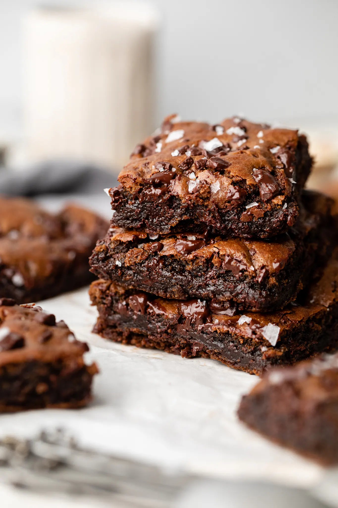 Stack of brownies on a marble surface with blurred background
