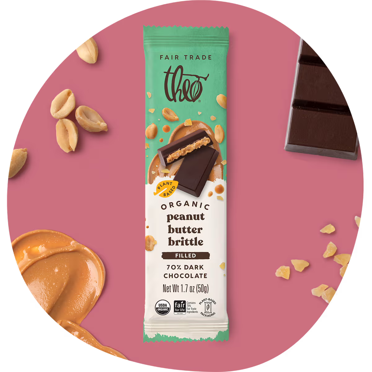 Theo Organic Peanut Butter Brittle filled 70% Dark Chocolate packaging on a pink background with chocolate and peanut elements.