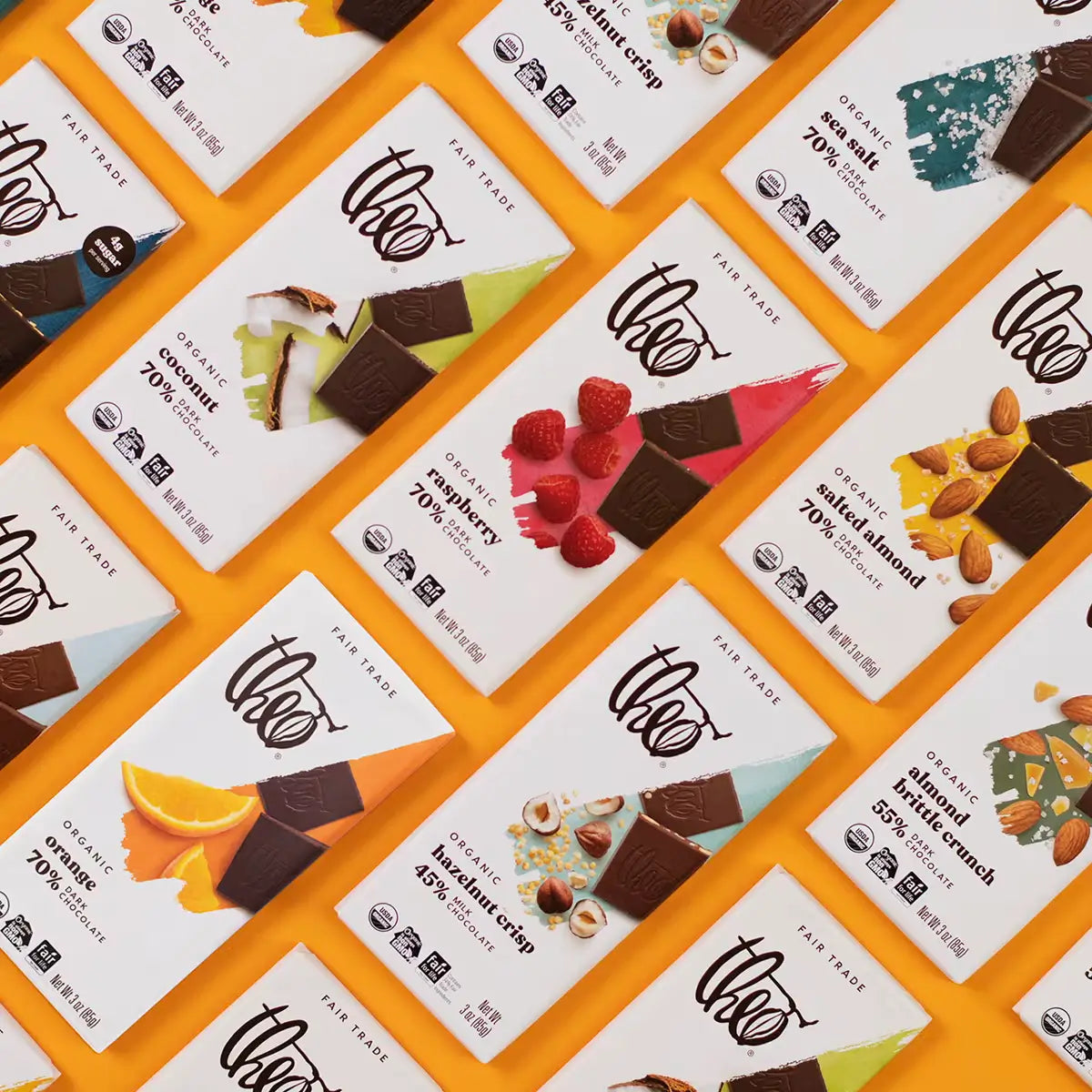 Various chocolate bars with their packaging on a patterned background